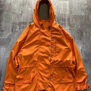 Bright orange rain coat in great condition no signs of wear